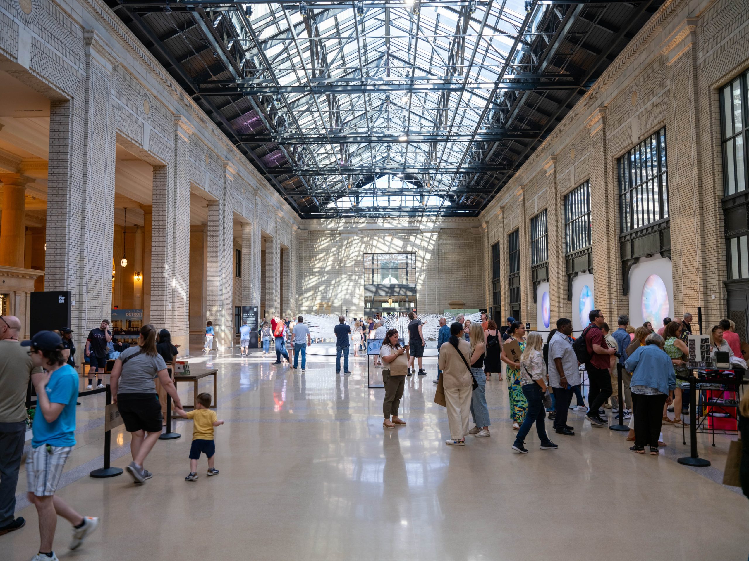 People walking around inside Michigan Central