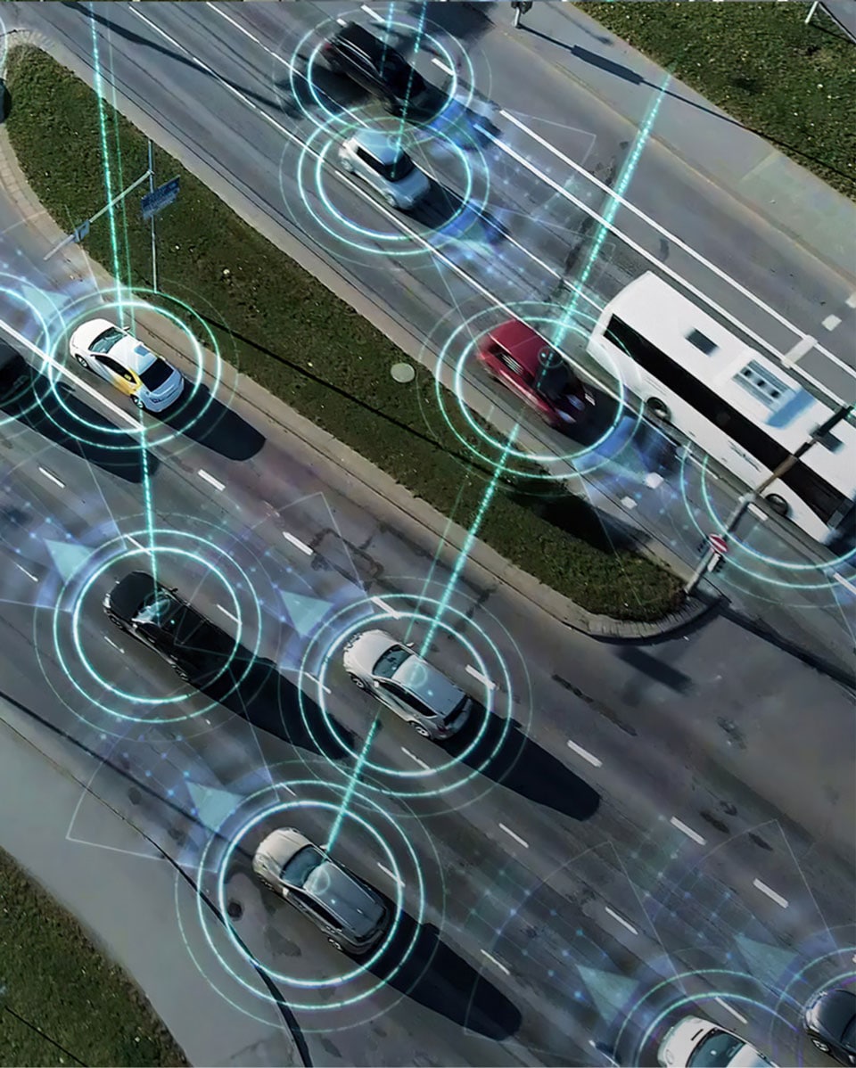 Artist interpretation of self-driving cars on a busy highway.